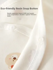 Macro detail of infant organic cotton shirt with food-grade resin snap buttons
