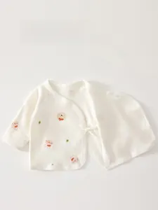 Detail of newborn cotton wrap top with double-layer belly guard and bear print