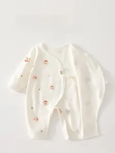 Detail of baby ivory cotton romper with cartoon bears and double-layered belly guard