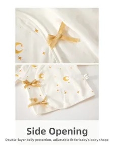 Detail of newborn cotton kimono top with star moon prints and side tie closure