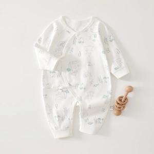Detail of infant long sleeve romper with mushroom prints and side-tie kimono closure