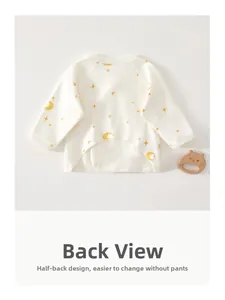 Detail view of cotton baby kimono top with half-back design and yellow moon pattern