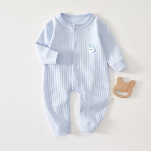 Close-up of baby long sleeve romper with blue rib-knit texture and rabbit embroidery