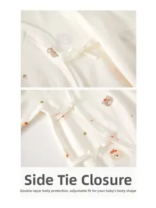 Detail of cotton baby romper with bear print and adjustable side ties for belly protection