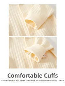 Detail of ribbed cotton baby romper sleeve with embroidery and high-quality stitching