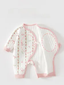 Detail showing the quilted cotton fabric and snap button crotch of the baby bodysuit