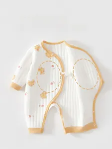 Detailed view of quilted warm baby romper with bear print and snap buttons at the bottom