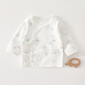 Detail of newborn cotton kimono top with plant print and protective mitten cuffs