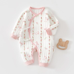 Detail of pink floral baby romper featuring cute bunny prints and cotton quilted texture