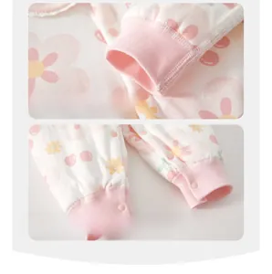 Detail of baby romper featuring rib knit cuffs and a wide crotch for diaper comfort