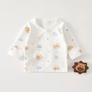 Detail of newborn cotton kimono top with bear print and side tie closure design