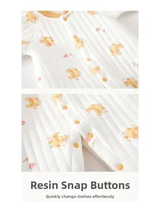 Detail of warm quilted cotton baby romper with secure resin snaps and cute bear print