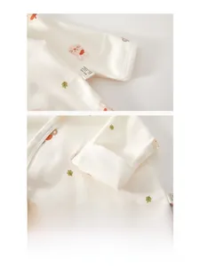 Macro detail of seamless cotton baby shirt with pink rabbit print and A-class stitching