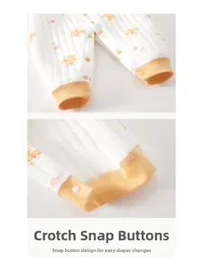 Detail of baby quilted romper with orange bear prints and convenient crotch snap buttons