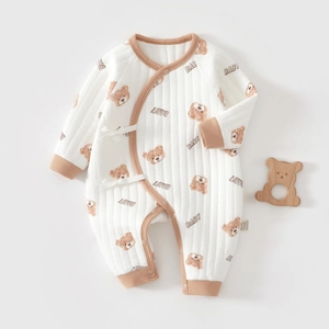 Detailed quilted texture and cute bear print on white cotton baby bodysuit