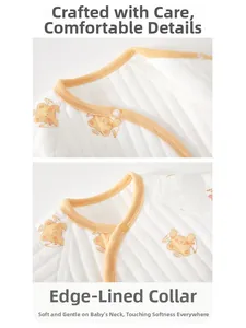 Close-up of baby romper yellow piped neckline with cute orange bear and heart patterns