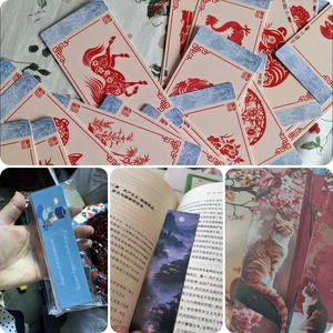 Dettaglio di segnalibri decorativi in carta con motivi artistici floreali e zodiacali