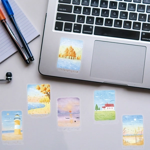Set of 6 aesthetic watercolor landscape stickers featuring nature scenes on laptop