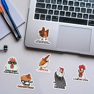 Close-up of waterproof cartoon chicken stickers with funny quotes on a laptop surface