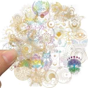 Macro view of holographic sun and moon PET stickers with metallic gold foil details