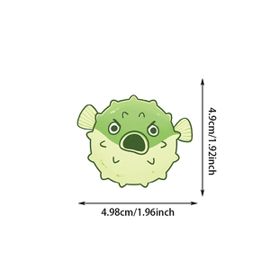 Close-up of a green cartoon puffer fish sticker with precise size measurements
