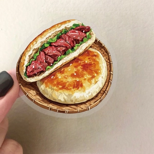 Close-up of a waterproof PET sticker featuring a colorful hand-drawn Chinese breakfast bun