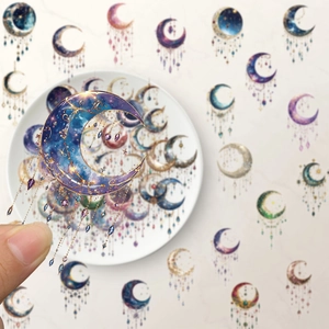 Macro shot of dream galaxy PET sticker with crescent moon and star patterns for scrapbooks