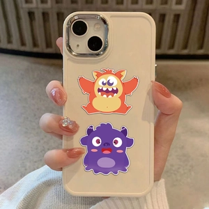Close-up of cute cartoon monster phone case for iPhone series held in hand