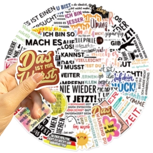 Macro shot of colorful German motivational stickers featuring various inspirational phrases