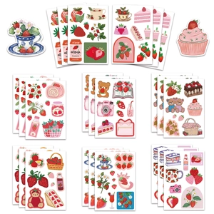 Detailed view of 8 sheets of cute strawberry themed stickers for DIY decoration