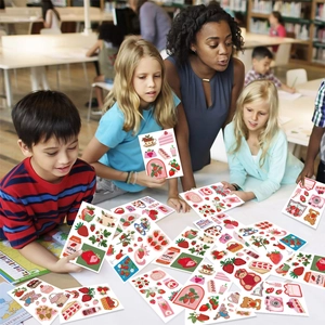 Close-up of strawberry aesthetic stickers on a desk with students in the background