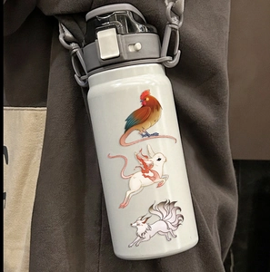 Water bottle with Chinese mythical creature stickers and adjustable shoulder strap