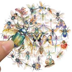 Detailed close-up of insect PET stickers featuring metallic beetles and butterflies