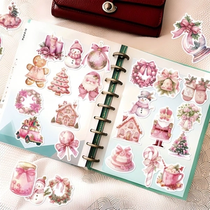 50 pack of pink Christmas stickers with gingerbread man, snowman, and tree designs