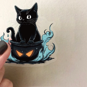 Waterproof Halloween black cat in cauldron transparent PET sticker held by hand