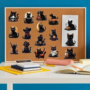 Detailed view of Halloween black cat stickers on corkboard with cozy desk stationery