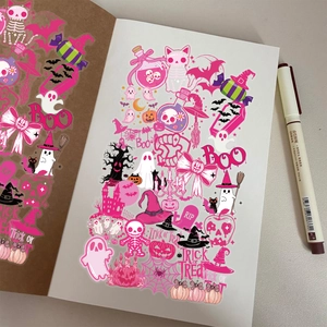 Creative pink Halloween stickers with skulls and pumpkins on notebook page