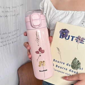 Pink thermal water bottle with dried flower patterns and secure locking lid