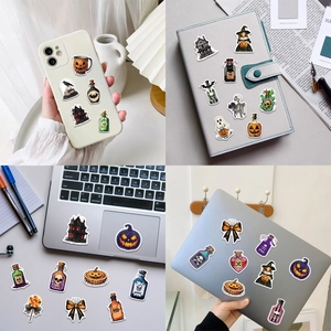 Halloween magic potion stickers applied on a phone case and laptop for creative DIY decor