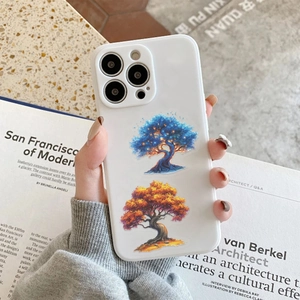 Close-up of artistic glowing tree pattern on a white protective case for iPhone series