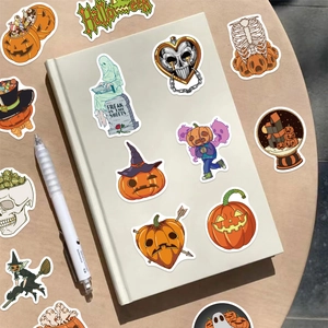 Close-up of cartoon Halloween stickers on a notebook with pumpkins and ghosts