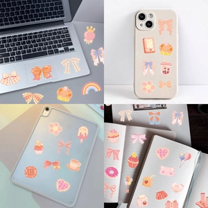 Close-up of pink cute PET stickers applied on laptops, phone cases and DIY journals