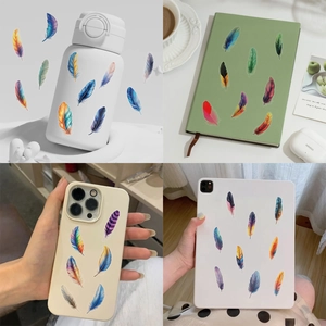 Detailed views of colorful feather PET stickers on a phone case and laptop surface