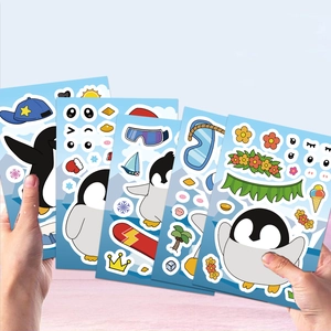 Close-up of hands holding multiple colorful DIY penguin puzzle stickers for kids' creativity
