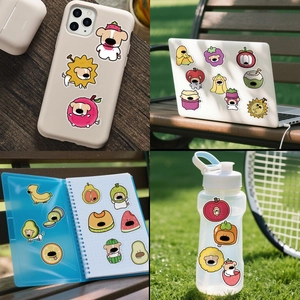 Creative fruit dog stickers shown on laptop, phone case, and water bottle surfaces