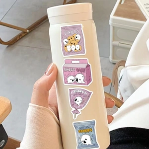 Close-up of waterproof cartoon Halloween food stickers on a cream-colored insulated water bottle