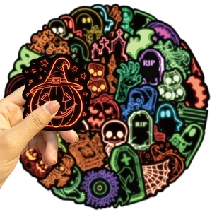 Neon Halloween stickers featuring pumpkin and skull designs for laptops and water bottles