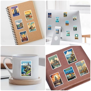 Travel landmark stickers applied on notebook, mug, laptop, and leather folder surfaces