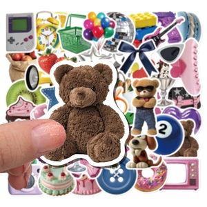 Close-up of cute Y2K cartoon stickers including a teddy bear for DIY phone cases