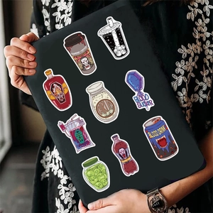 Gothic vampire theme stickers on black laptop sleeve featuring horror food and drinks